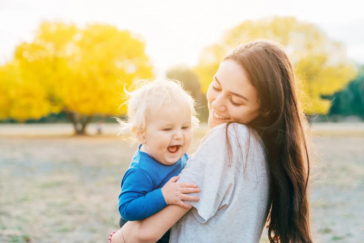 Young mother with child on walk