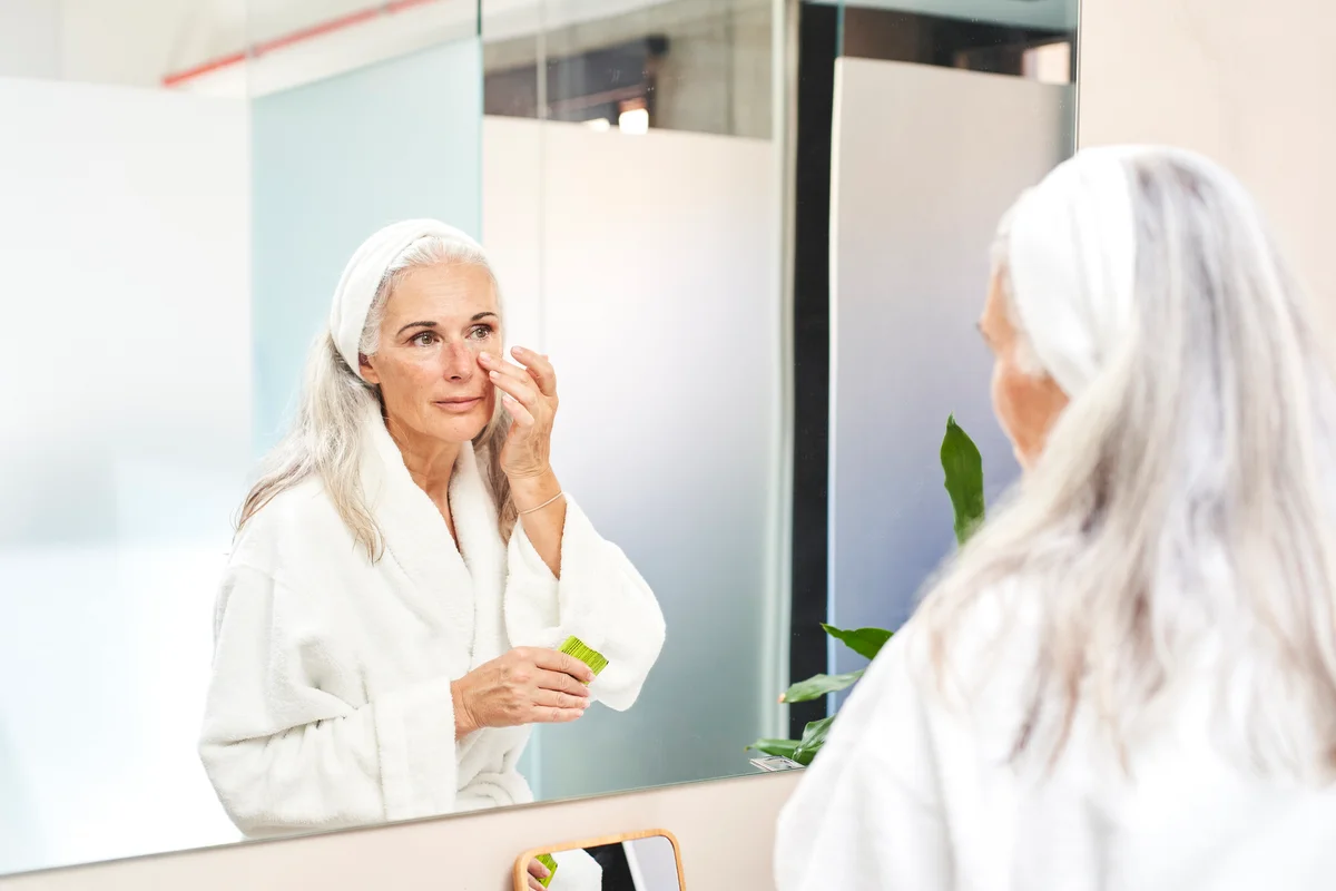 woman applying eye cream