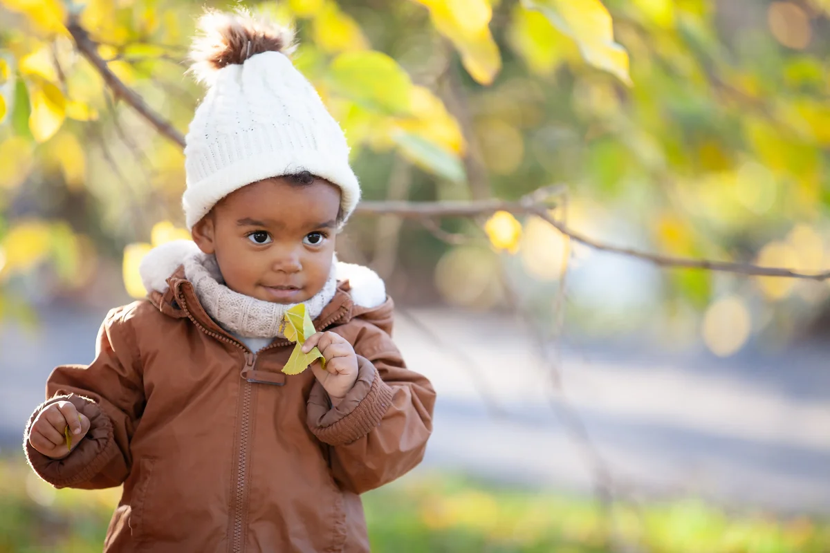 cute baby by tree