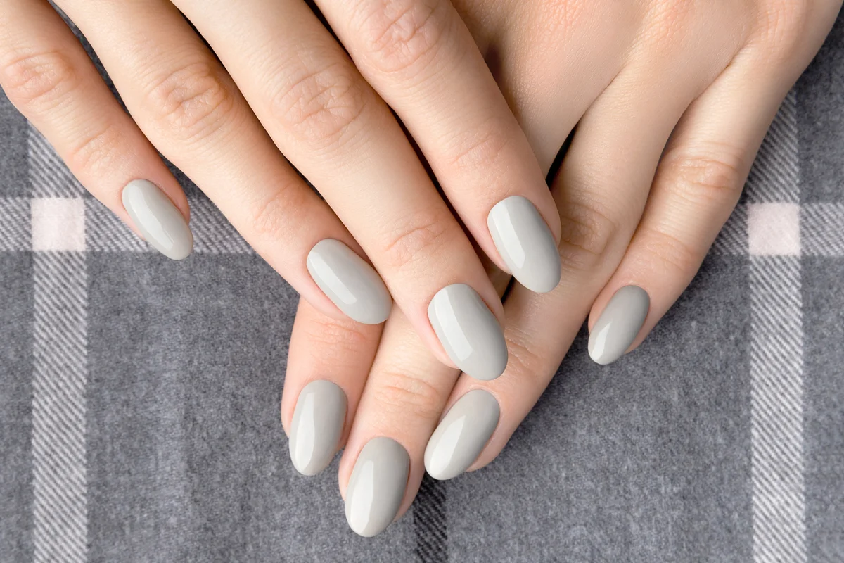 Womans hands with greige manicure