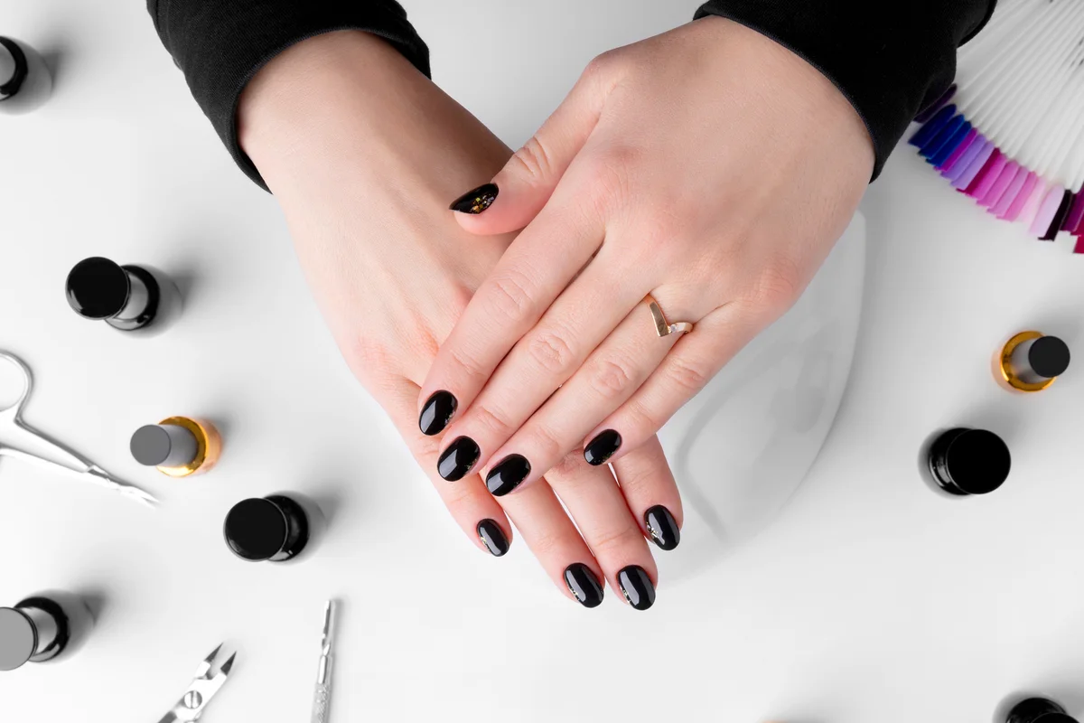 Woman with black nail polish