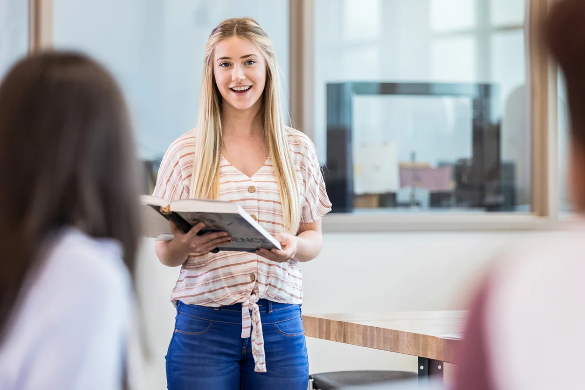 A confident young adult teaches the day's lab