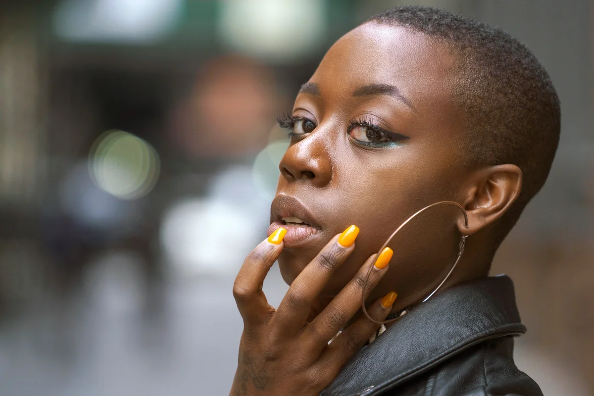 Woman with yellow nails on the street