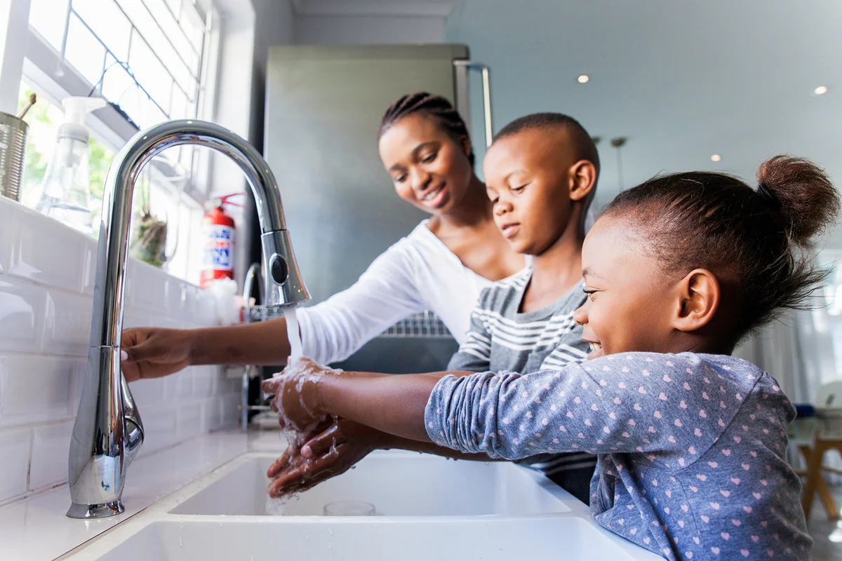 Family washing their hands together