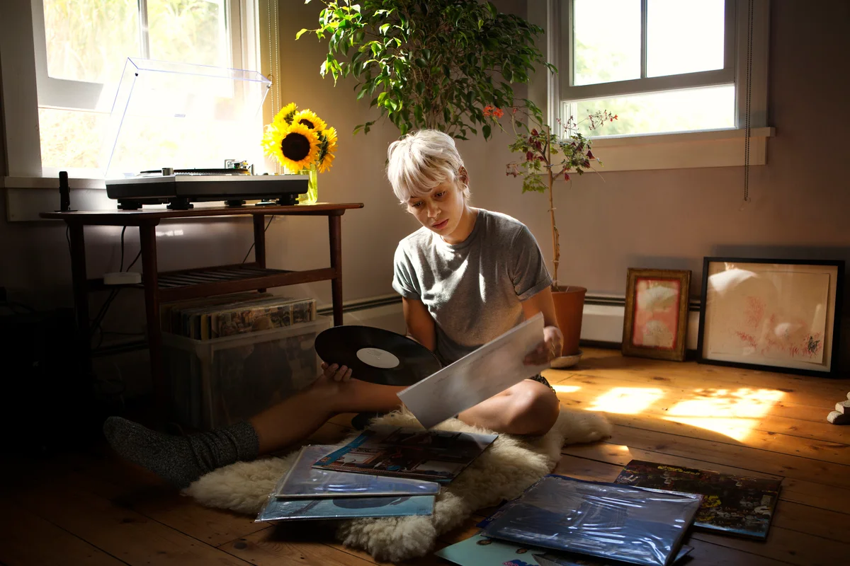 woman looking at vinyl records