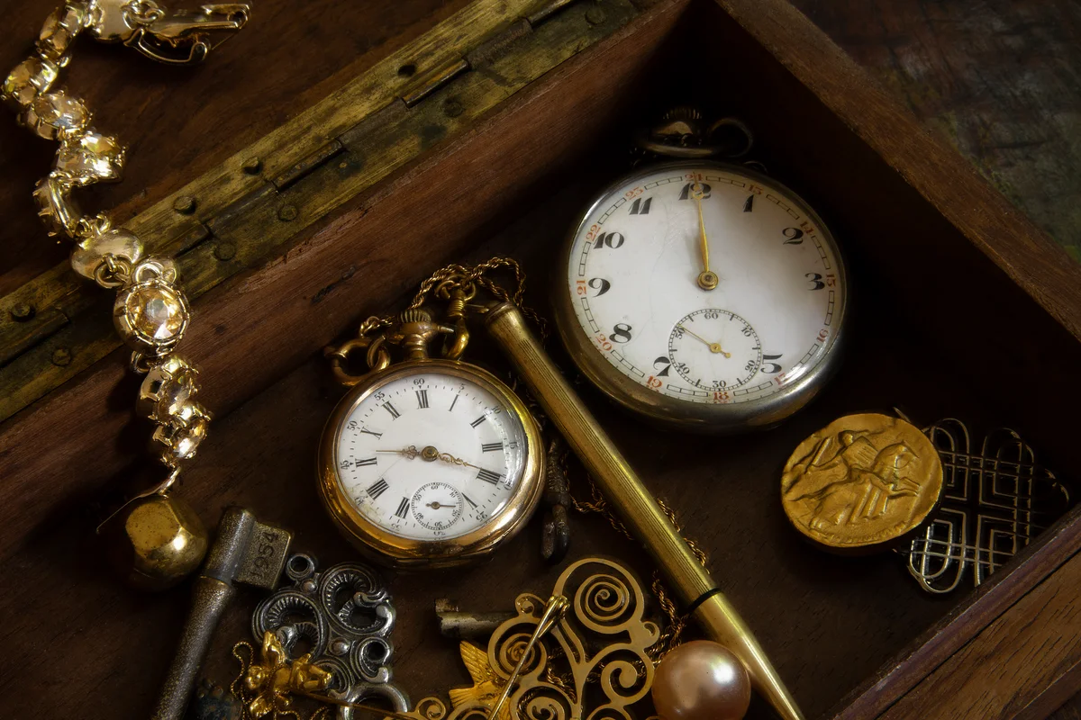 box of old watches and jewelry