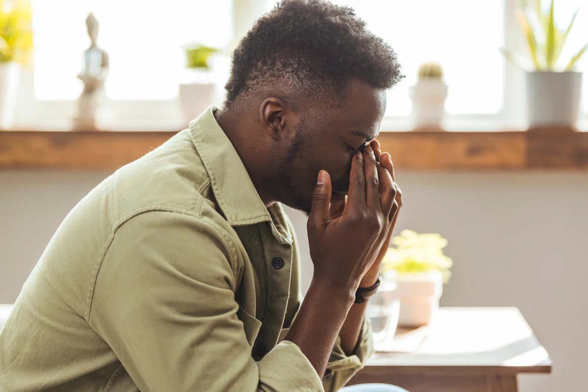 young man with migraine