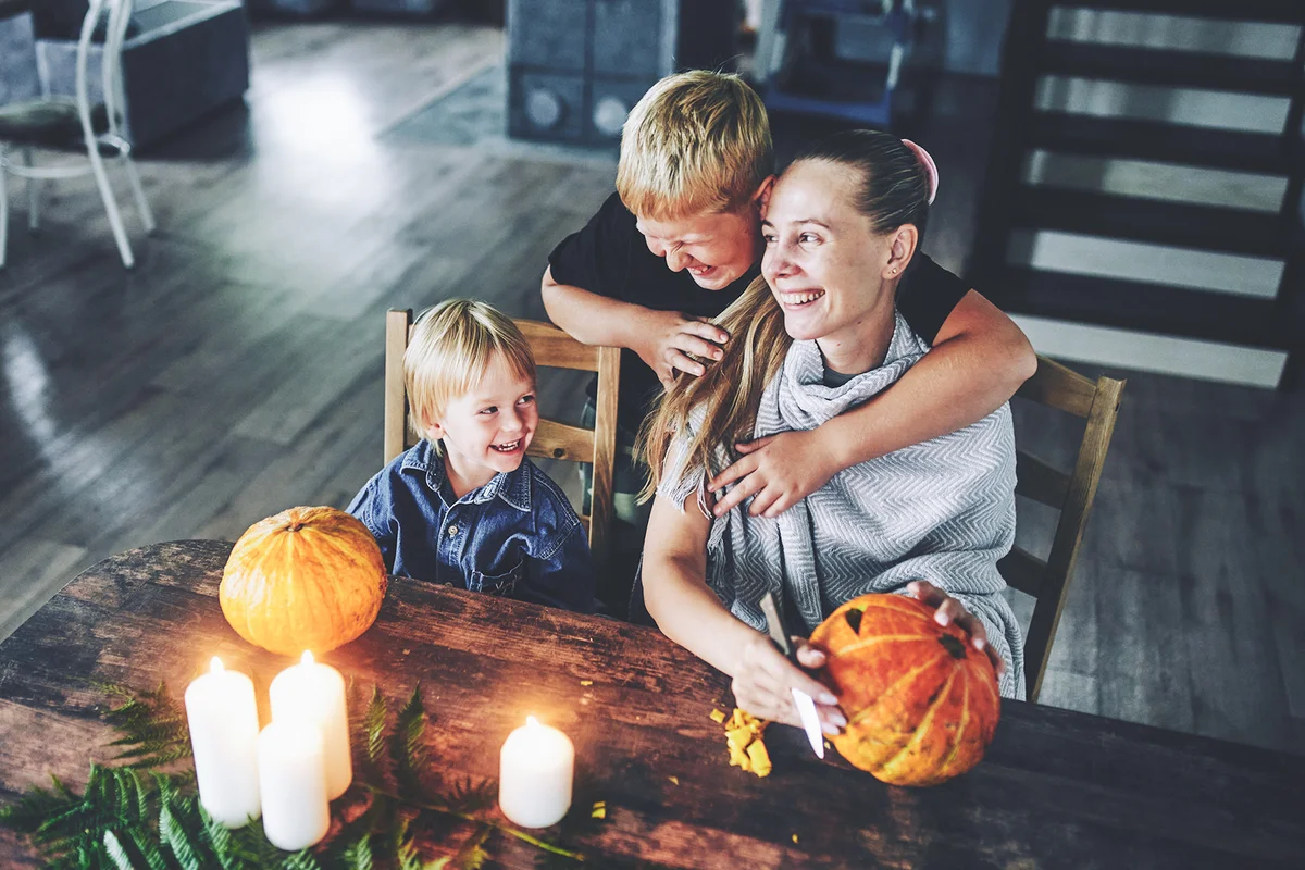 Mother and her sons are preparing for Halloween