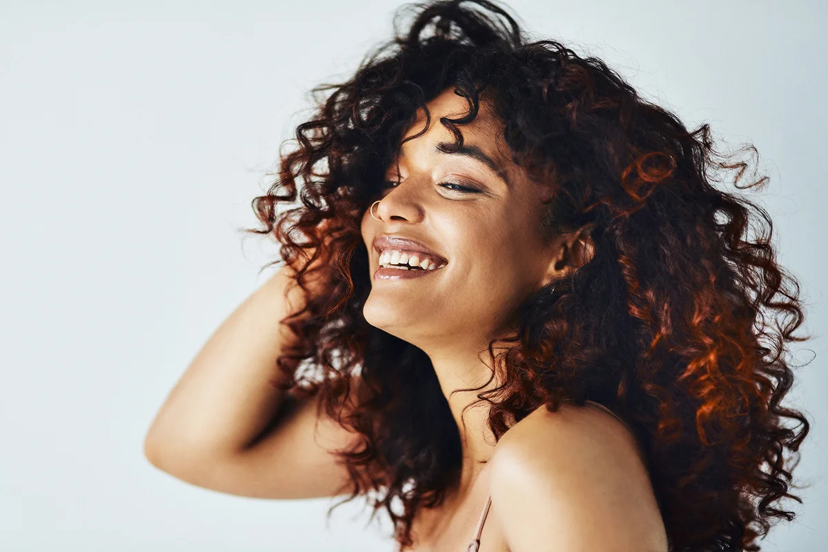 young woman feeling playful while posing