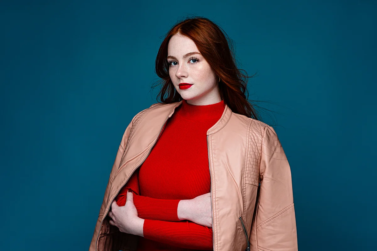 beautiful attractive woman wearing red turtleneck sweater
