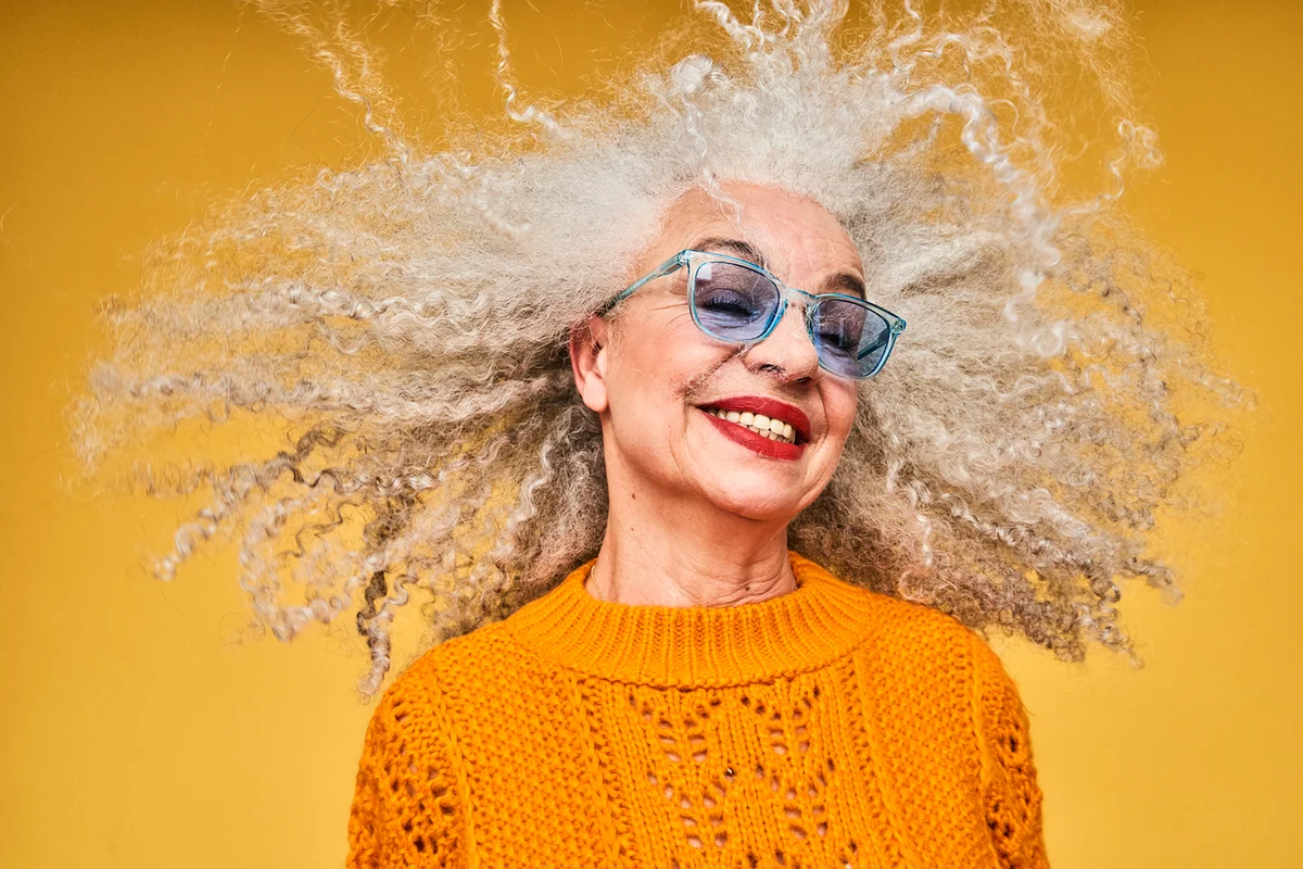 Colourful studio portrait of a senior woman