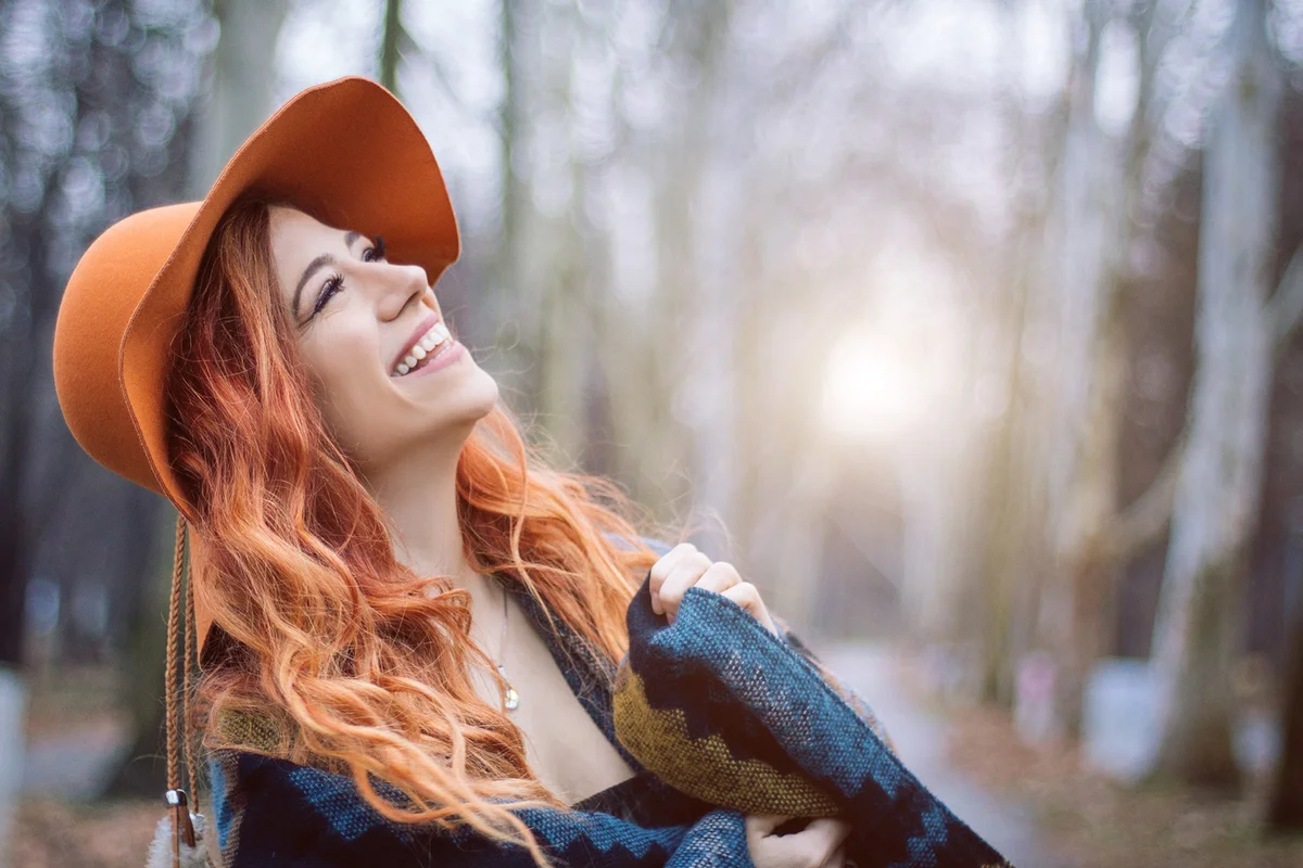 Redhead woman enjoy in the wood