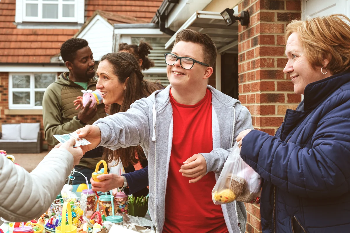 Person Paying for an Item at a Yard Sale