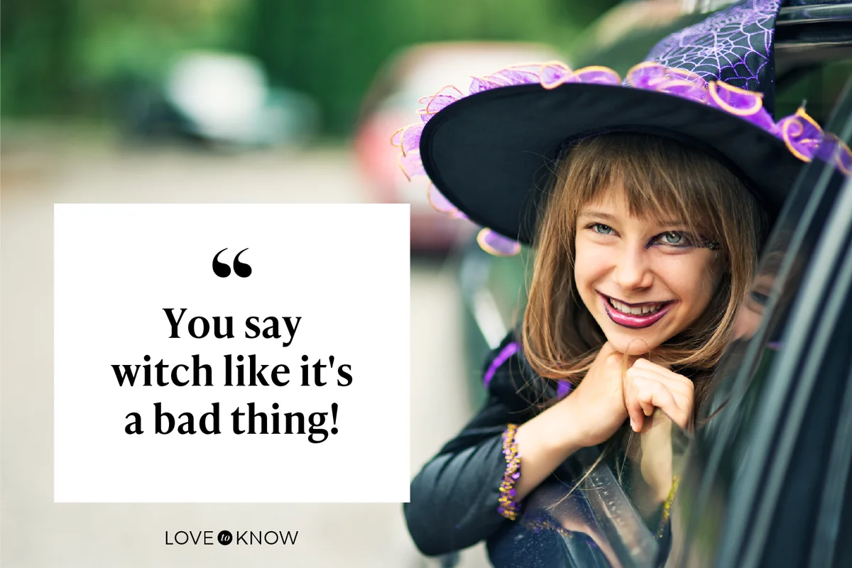 Little halloween witch smiling out of the car