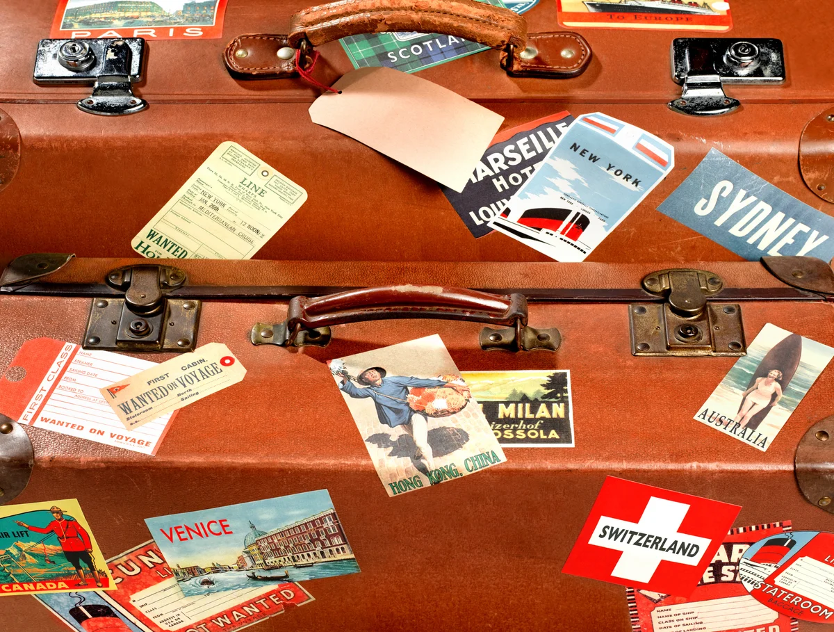 Close up of suitcase with travel stickers