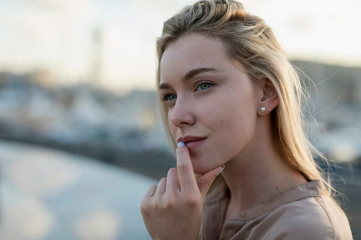 Woman with blue eyes looking into the distance