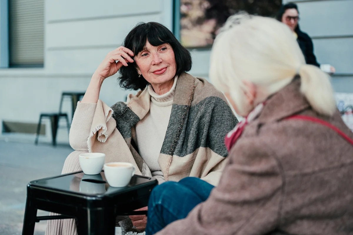 Two older female friends talking