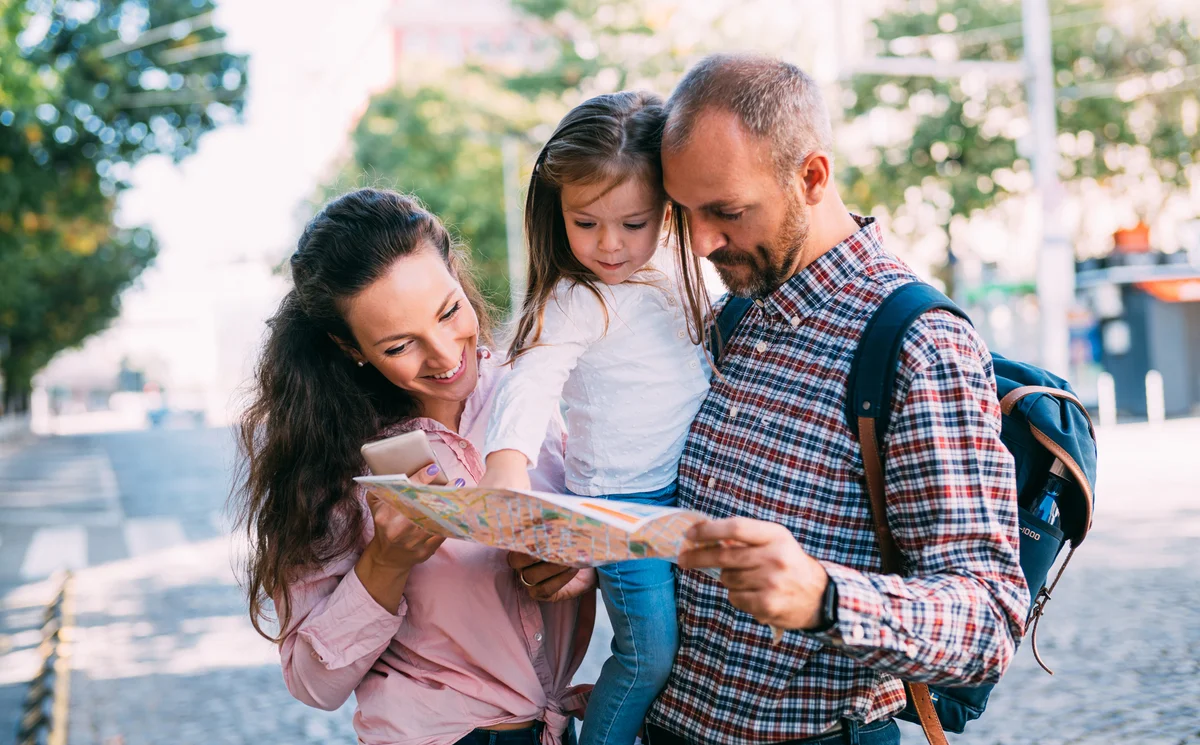 Family looking at map with toddler