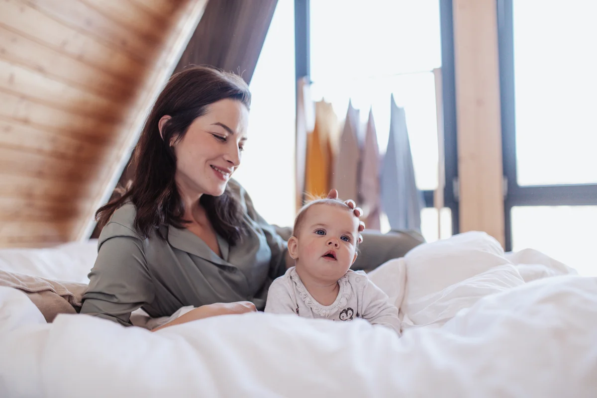 Young mother and her child in hotel room