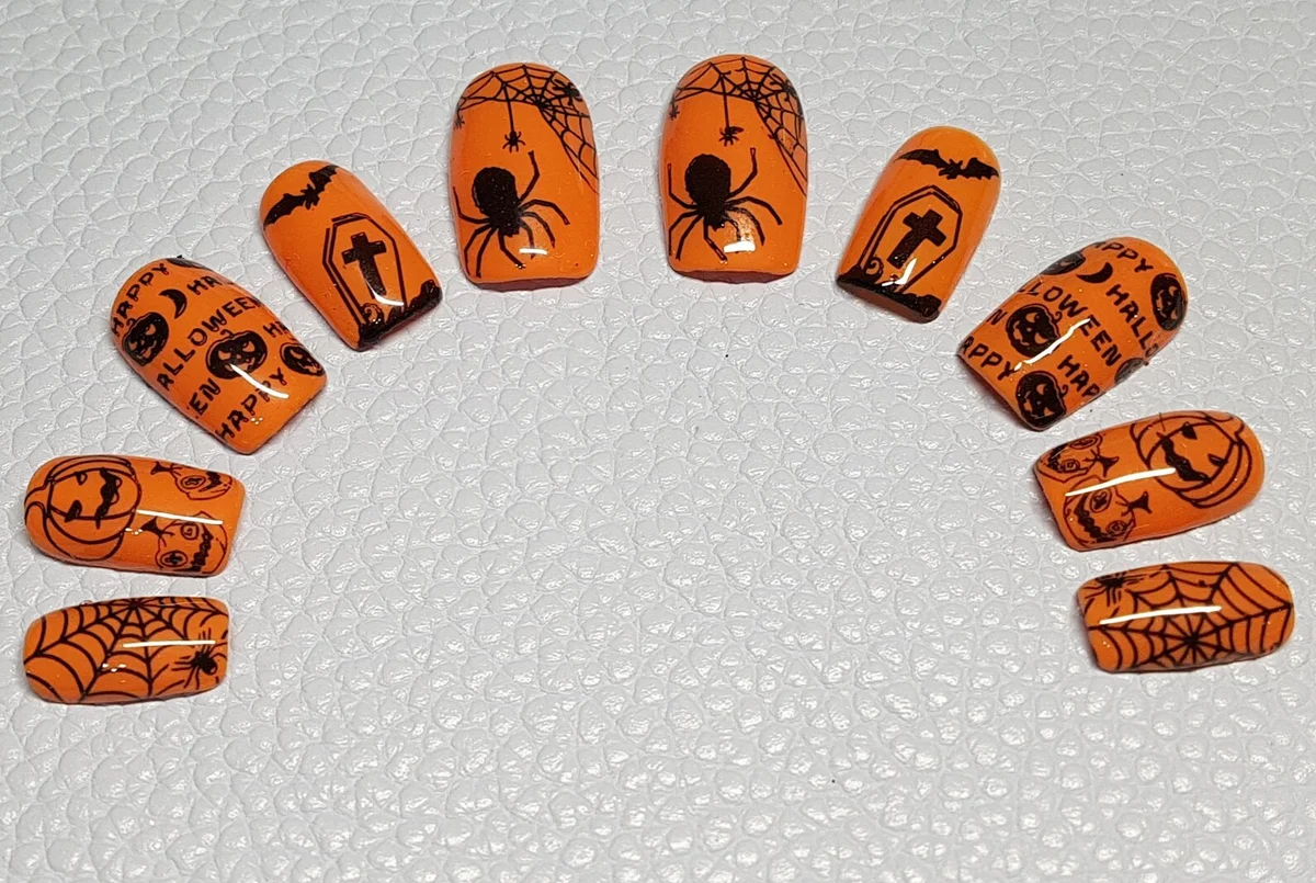 Orange Halloween Press On Nails with spiders, webs, pumpkins and bats