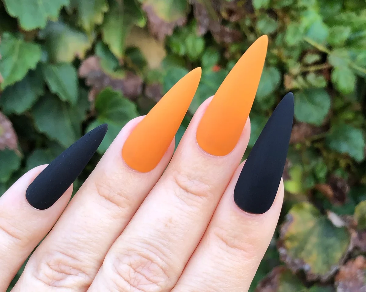 Orange and black matte manicure