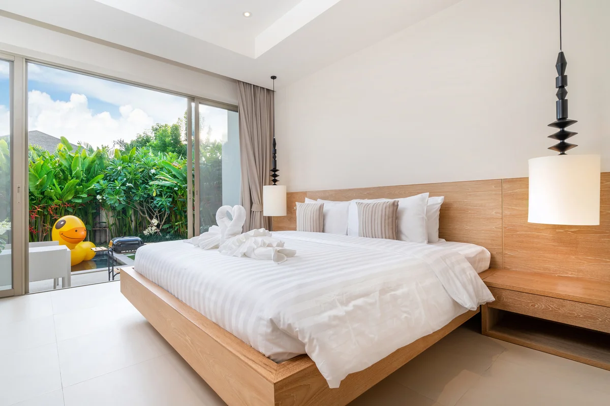 Bed with headboard in white room