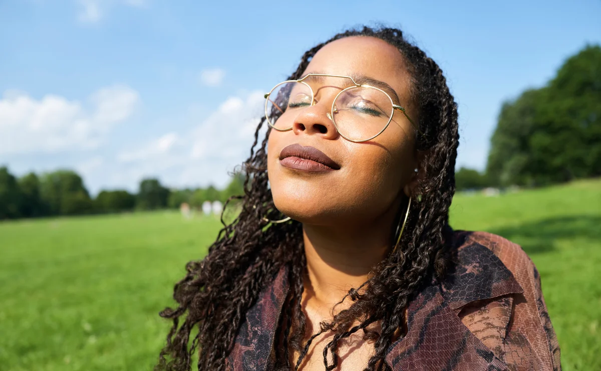 Woman smelling outdoors
