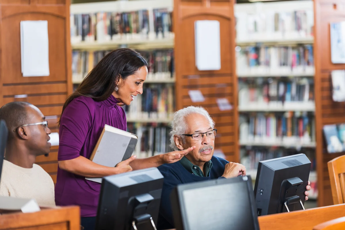 librarian helping older adults