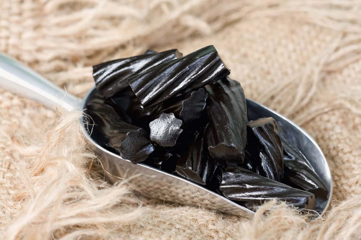 Scoop of Black Liquorice Candy on Burlap