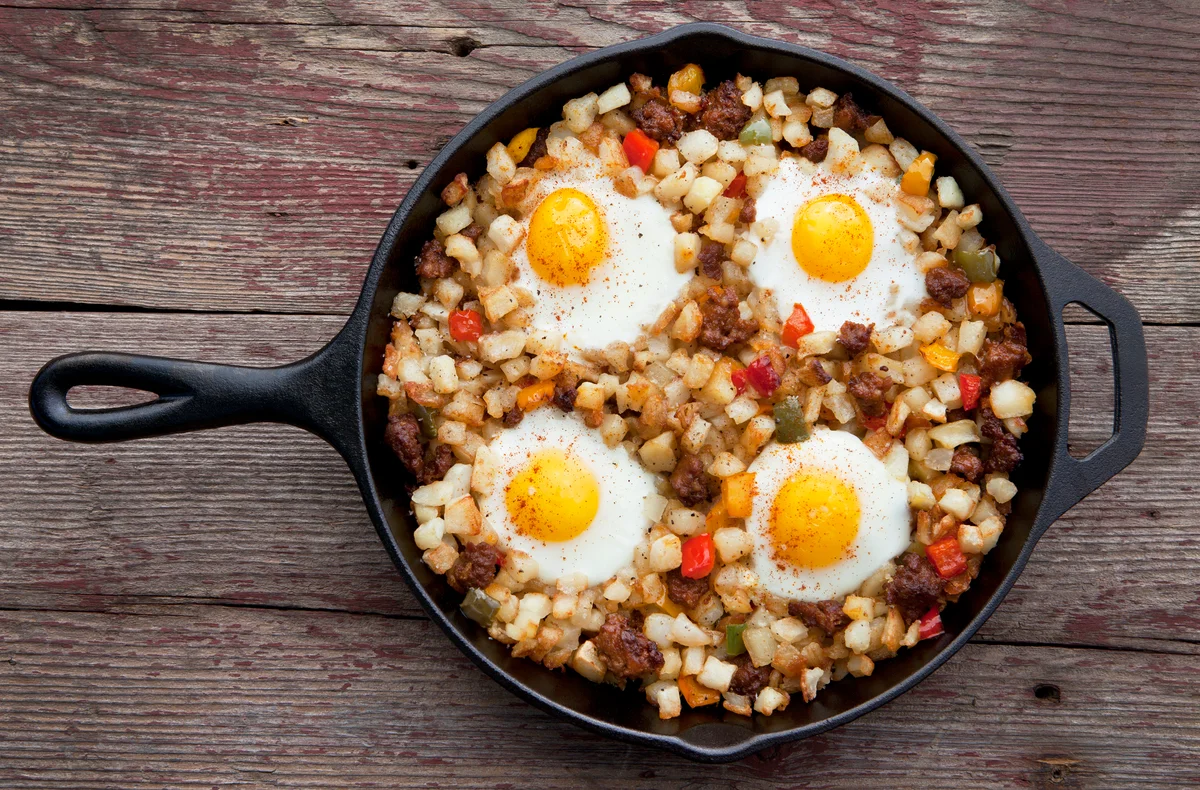 Overhead view of potato chorizo hash in a cast iron pan