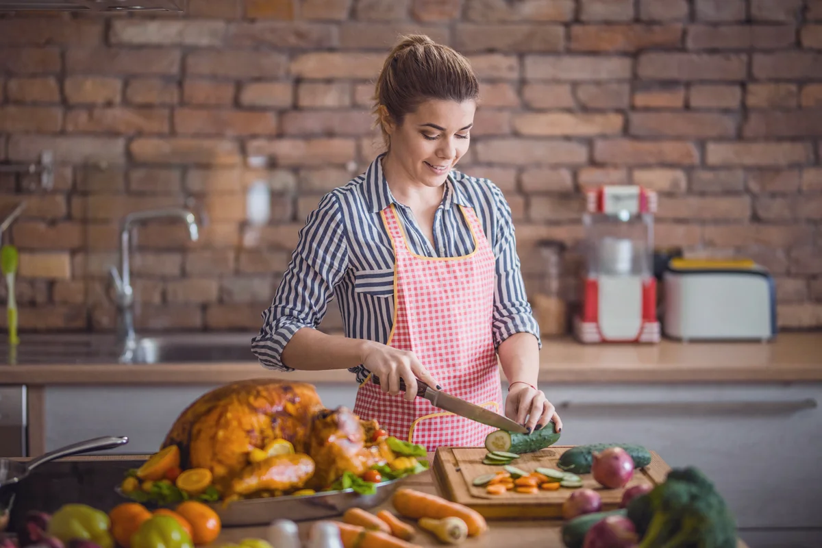 Woman preparing Thanksgiving dinner in the kitchen