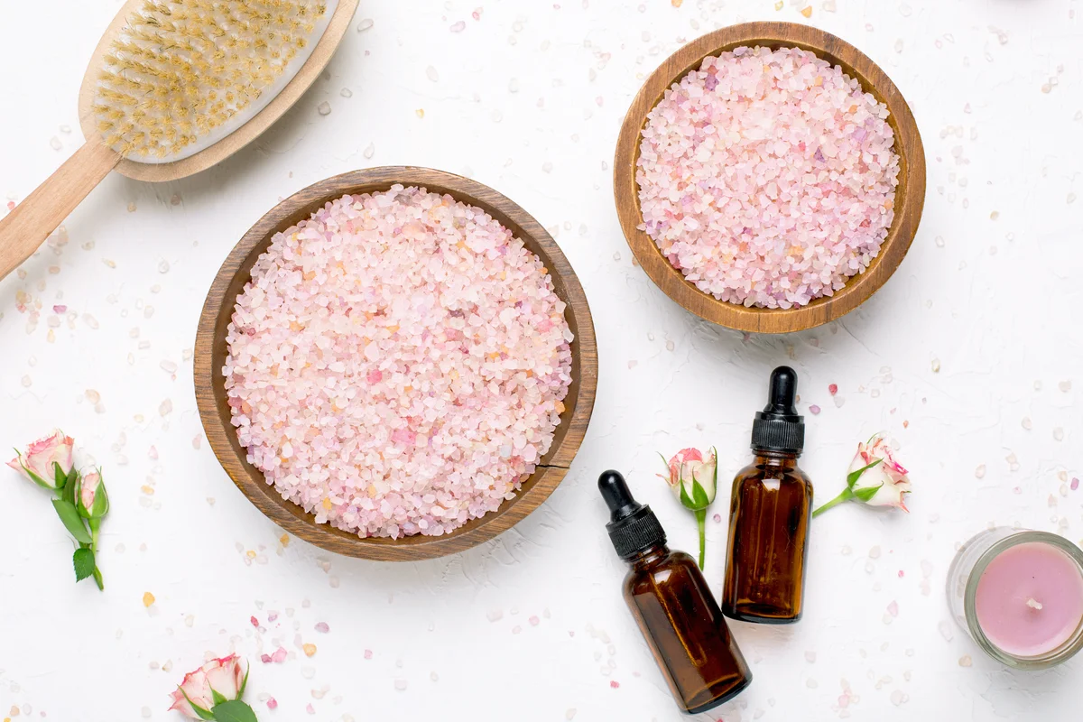 Rose bath salt and natural oil bottles