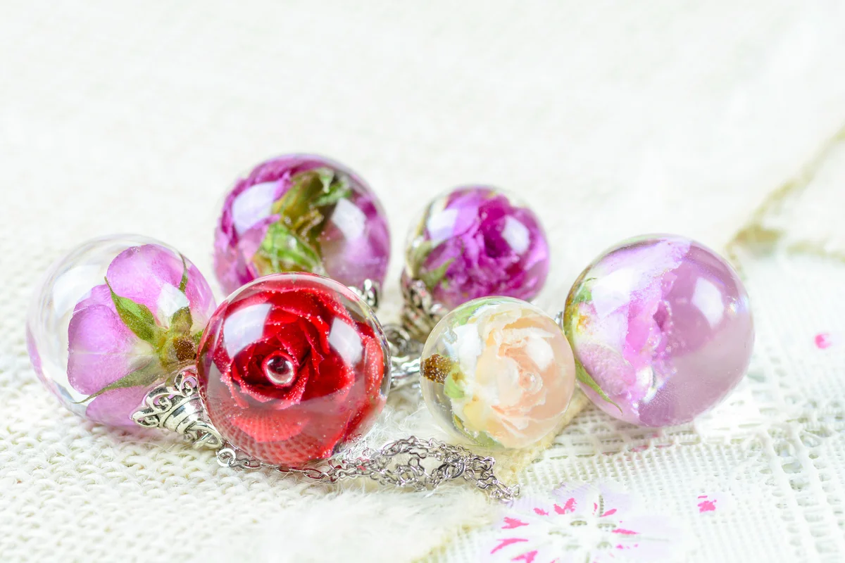 Dried rose in crystal clear resin pendant necklace