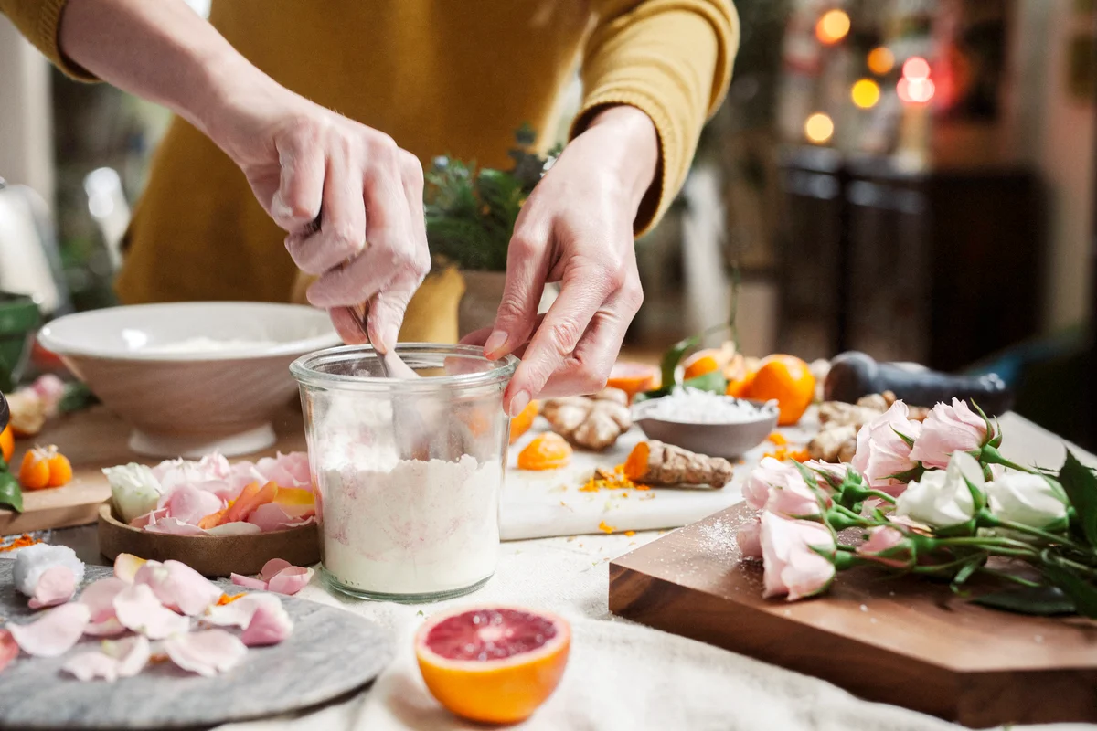Woman cooking with rose petals