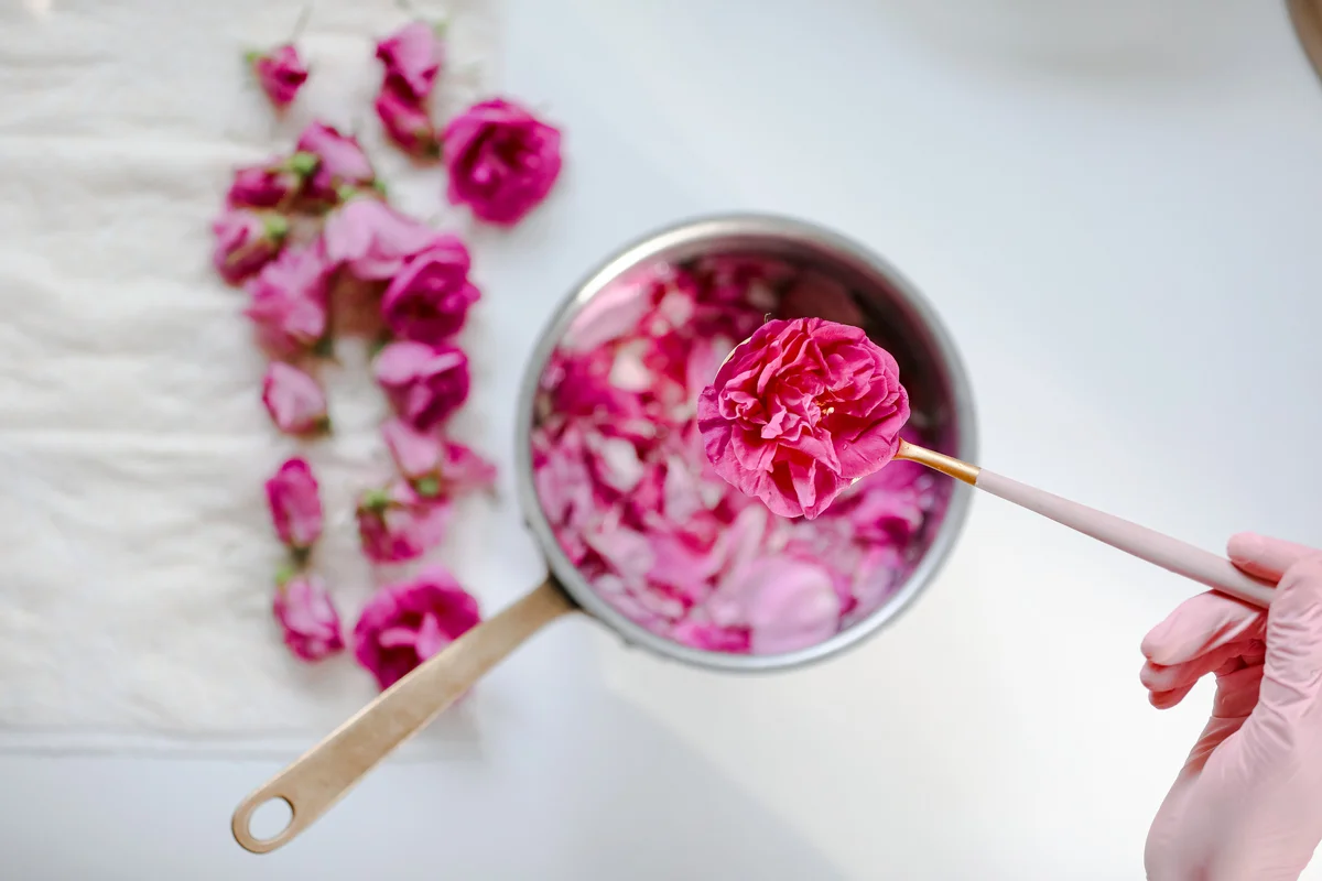 Woman making rose syrup