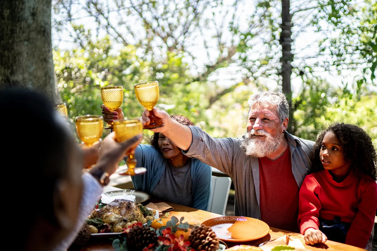 Family toasting on lunch day at home