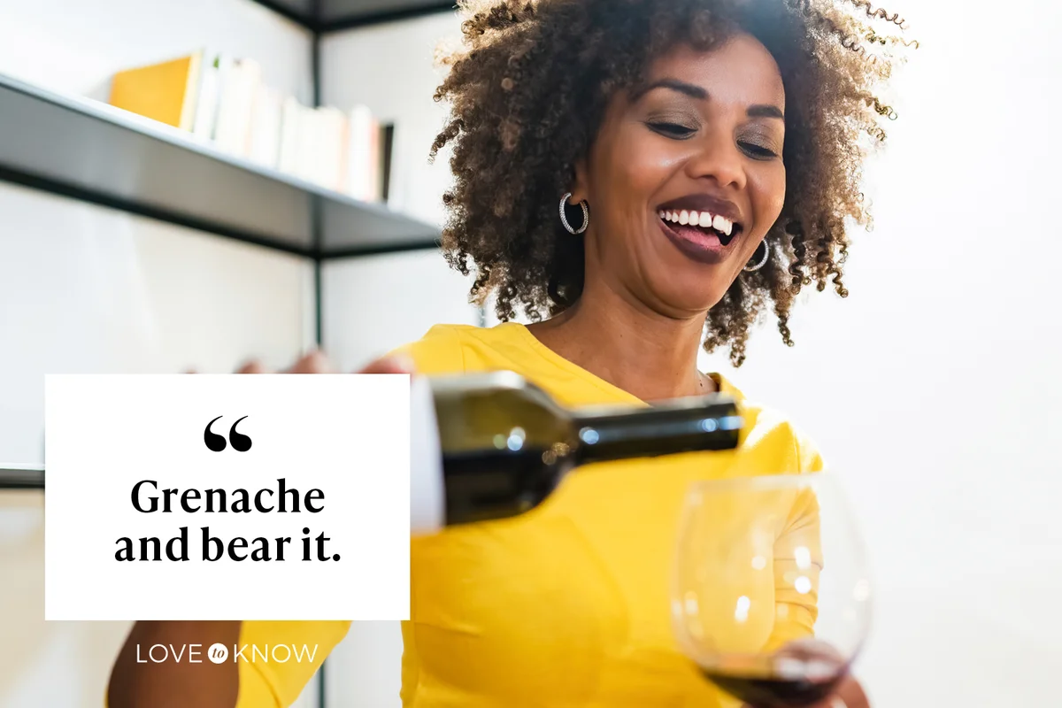 Woman pours wine into her goblet