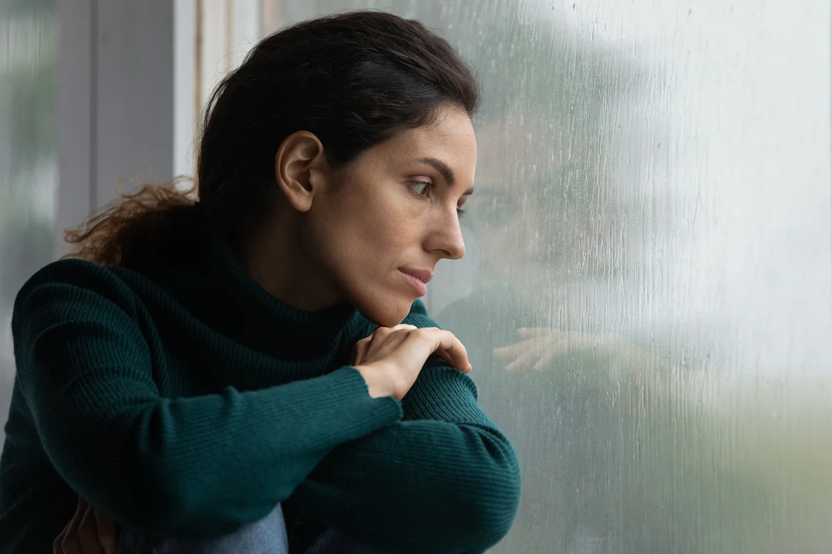 Stressed woman suffering from negative thoughts
