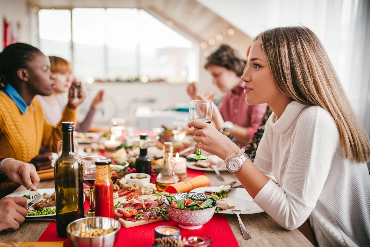 Multiethnic group of friends dining thanksgiving dinner