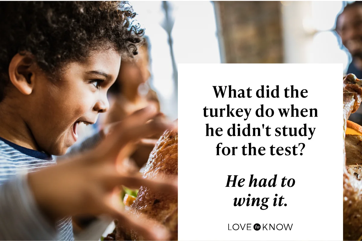 Boy about to bite stuffed turkey on Thanksgiving day