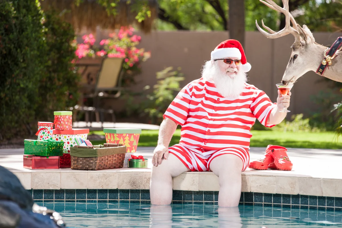 Santa with a cocktail poolside
