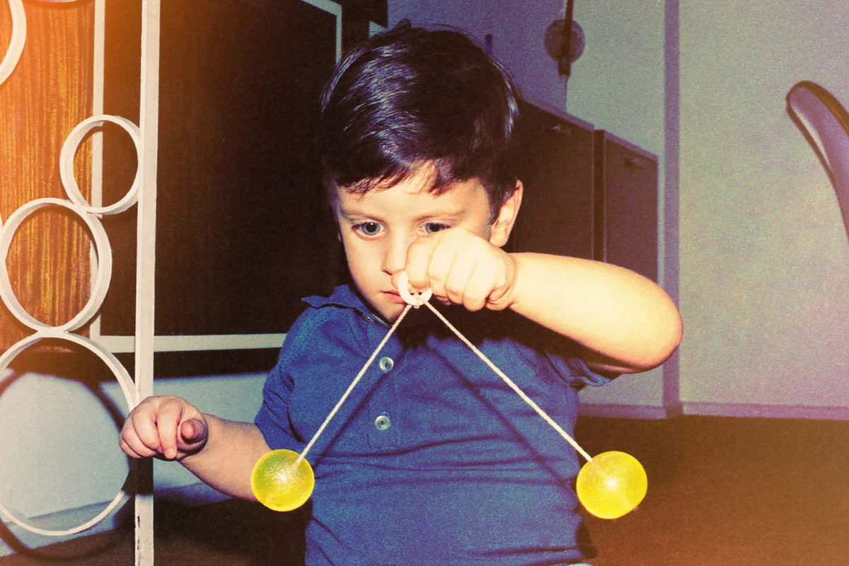 Little boy playing very focused