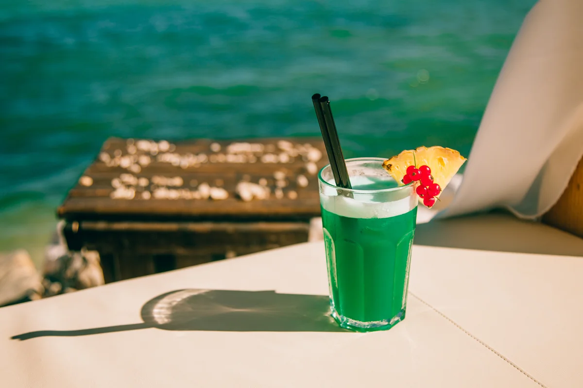 Summer green cocktail on a beach