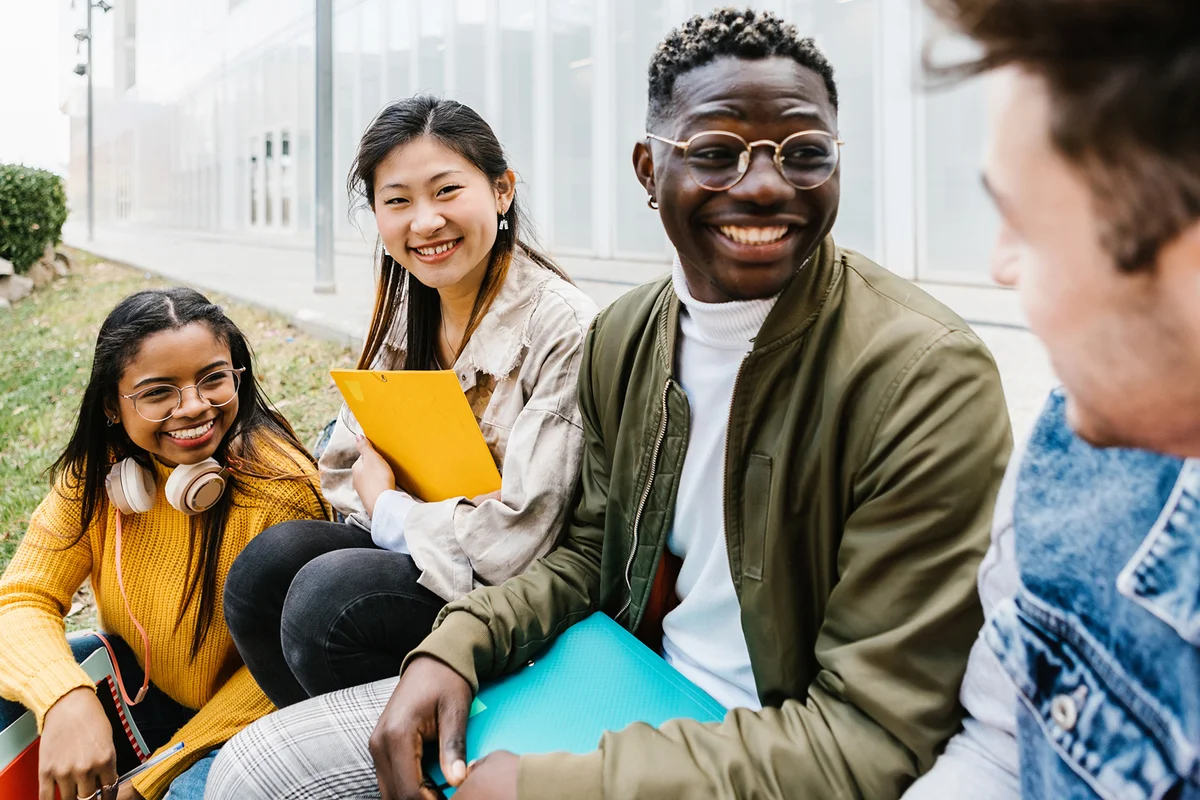 young student friends hanging out at university campus