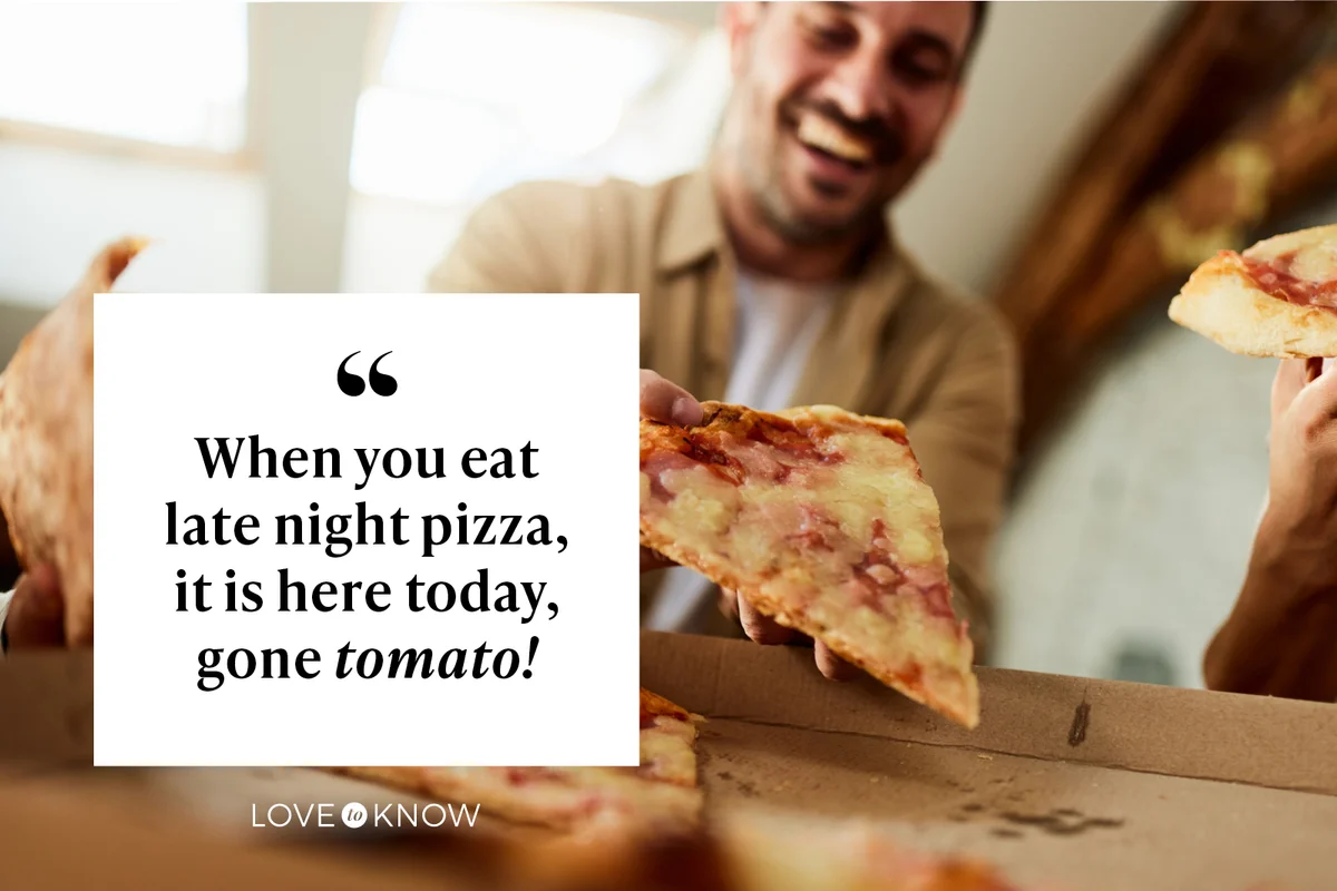 Man eating a slice of pizza