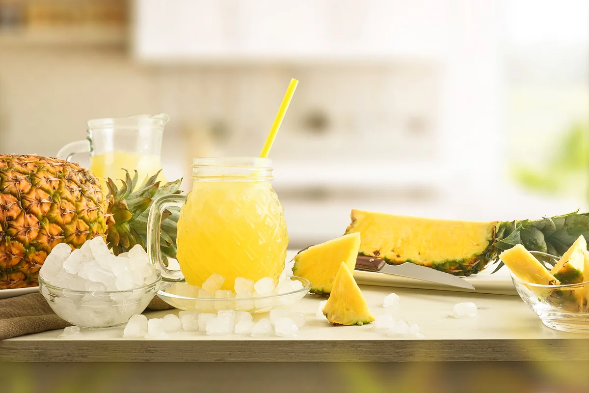 Glass with iced drink on table