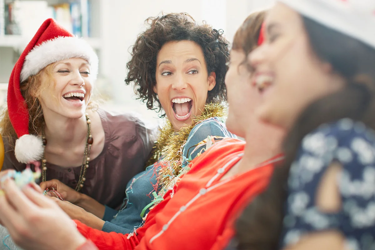 women laughing at funny Christmas poem