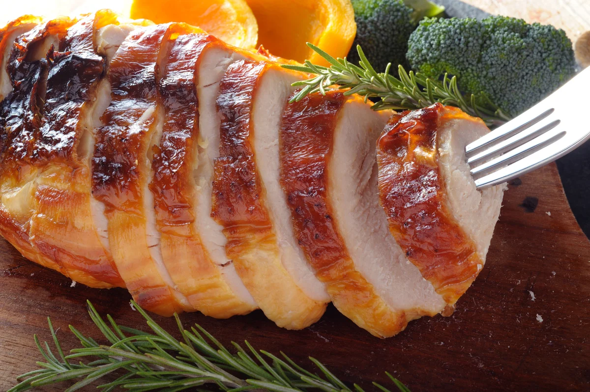 sliced, roasted turkey on a platter