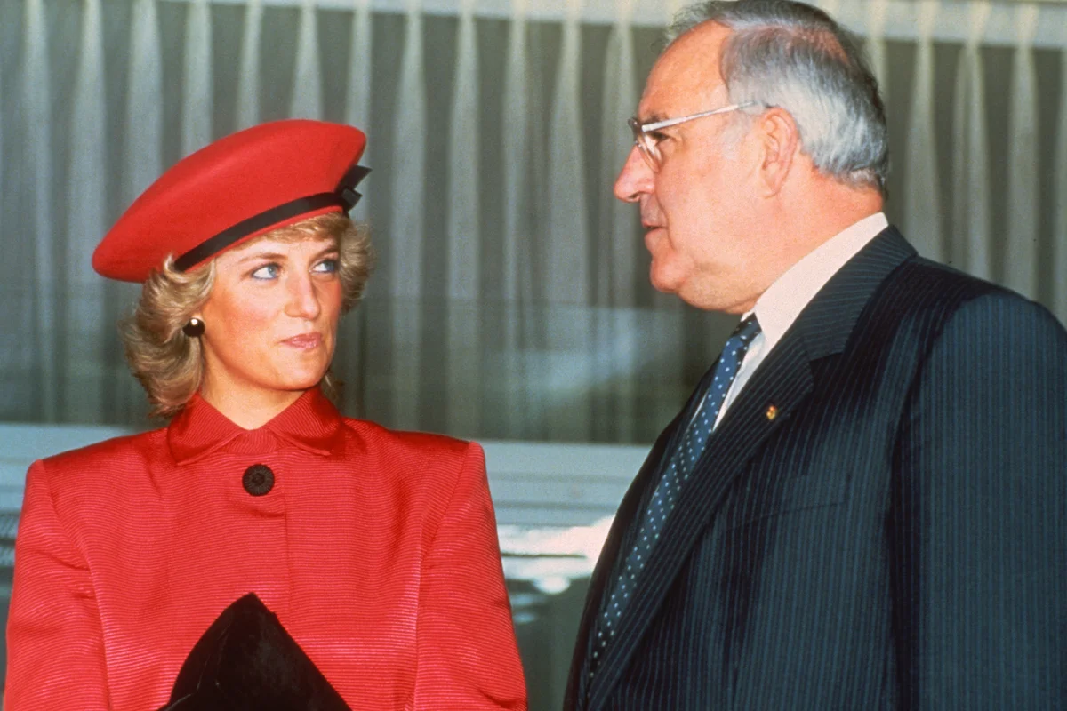 Diana, Princess of Wales, wearing a pink/red suit | Getty Editorial