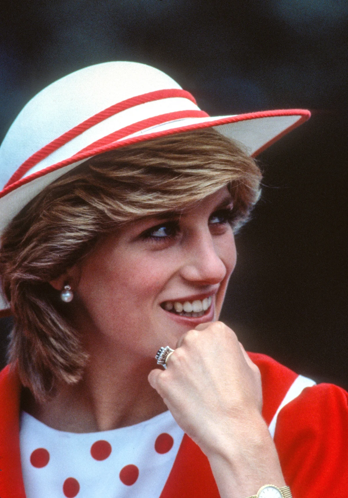 Diana, Princess of Wales, with a red jacket and a hat by John Boyd | Getty Editorial